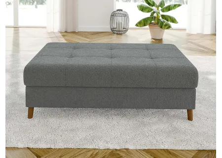 Lars - Ecksofa mit Schlaffunktion und Hocker mit Braun Holzfüßen im skandinavischen Stil aus Boucle-Stoff