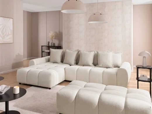 Bubble - Ecksofa mit Schlaffunktion und Hocker mit losen Rückenkissen und Sitzfläche in Bubble-Optik aus weichem Strukturstoff